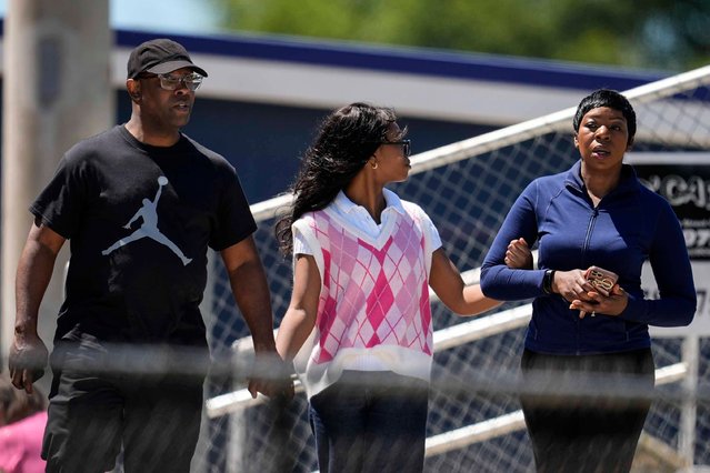 Parents walk their child out of Apalachee High School after a shooting at the school Wednesday, September 4, 2024, in Winder, Ga. (Photo by Mike Stewart/AP Photo)