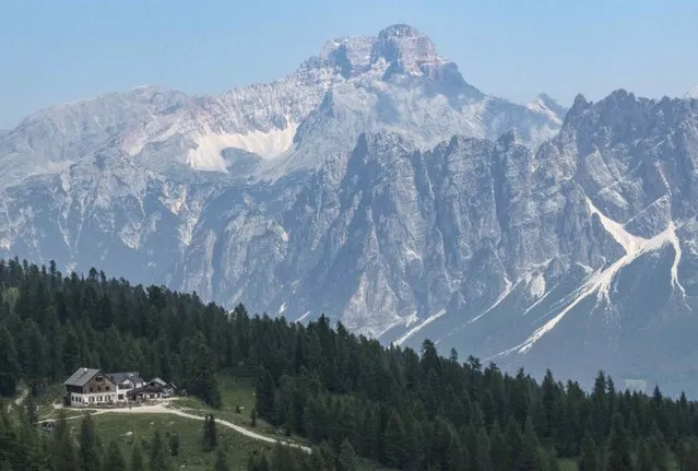 The Rifugio Croda da Lago in the Dolomite Mountains is seen near Cortina d' Ampezzo in northern Italy July 15, 2015. (Photo by Bob Strong/Reuters)
