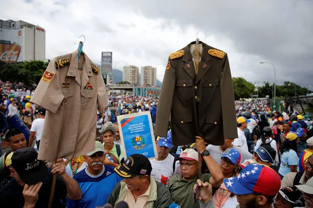 Demonstrators gather in front of a Venezuelan Air Force base while rallying against Venezuelan President Nicolas Maduro's government in Caracas, Venezuela, June 24, 2017. (Photo by Ivan Alvarado/Reuters)
