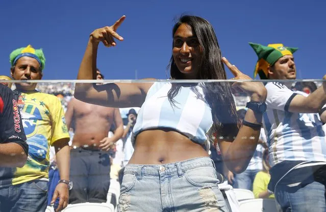 An Argentina fan cheers before the 2014 World Cup round of 16 game between Argentina and Switzerland at the Corinthians arena in Sao Paulo July 1, 2014. (Photo by Kai Pfaffenbach/Reuters)