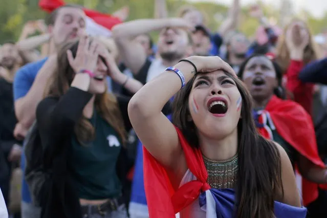France fans react as they watch the Switzerland v France EURO 2016 Group A soccer match at the fan zone in Paris, France, June 19, 2016. (Photo by Stephane Mahe/Reuters)