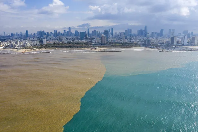 Mud water from Hayarkon river flows in to the Mediterranean Sea in Tel Aviv, Israel, Wednesday, January 22, 2020. (Photo by Oded Balilty/AP Photo)