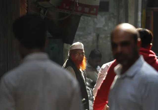 An Indian Muslim waits outside a polling station after casting his vote in the old quarters of New Delhi, India, Saturday, February 8, 2020. (Photo by Manish Swarup/AP Photo)