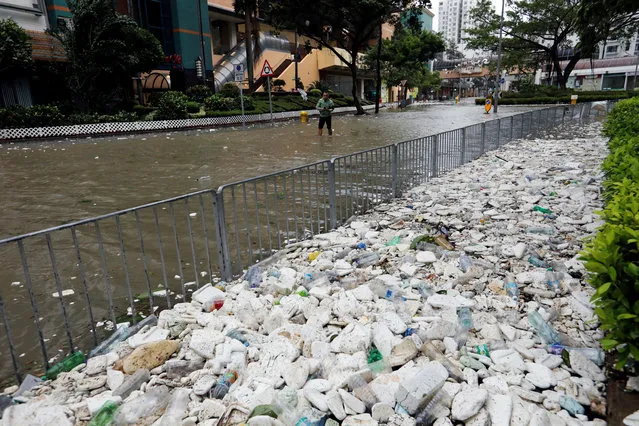 Rubbish and styrofoam are being washed up onto the pavement as Typhoon Hato hits Hong Kong, China on August 23, 2017. (Photo by Tyrone Siu/Reuters)
