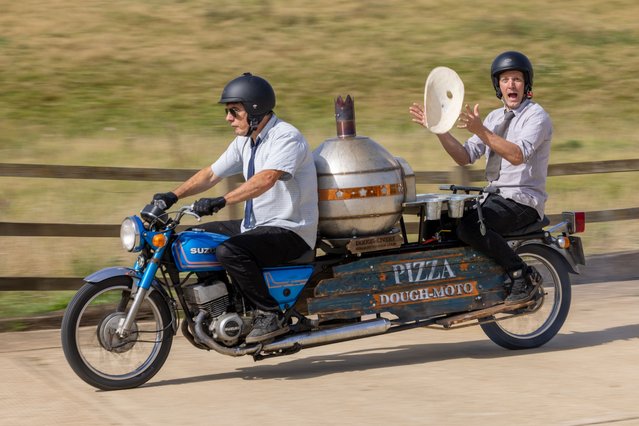 Colin Furze, 40, from Stamford, Lincolnshire, UK on September 7, 2023 makes a very thin base while speeding along on his latest invention: the only motorbike in the world with a built-in pizza oven. (Photo by Geoff Robinson/The Times)