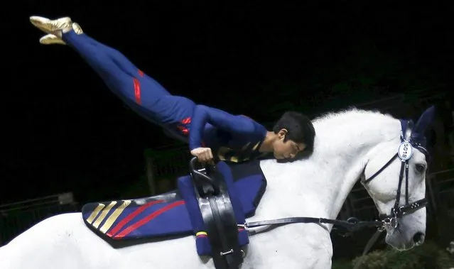 The Colombian team performs during the Squad Compulsory Vaulting competition at the World Equestrian Games at the Zenith in Caen, September 2, 2014. (Photo by Regis Duvignau/Reuters)