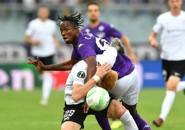 Fiorentina's Cristian Kouame in action with RFS' Petr Mares during Europa Conference League Group A Fiorentina v RFS match at Stadio Artemio Franchi in Florence, Italy on September 8, 2022. (Photo by Jennifer Lorenzini/Reuters)