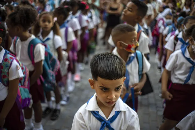 Students line up for their first day back to school after summer vacation at the Angela Landa school in Old Havana, Cuba, Monday, September 5, 2022. (Photo by Ramon Espinosa/AP Photo)