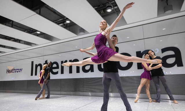 Dancers perform a Christmas ballet at Heathrow airport in London on December 4, 2023. (Photo by Matt Alexander/PA Wire Press Association)