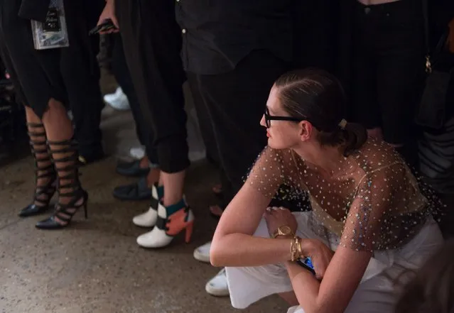 Creative director and president for J.Crew Jenna Lyons kneels as she looks on as the Chromat 2016 Spring collection is modeled during Fashion Week Friday, September 11, 2015, in New York. (Photo by Bryan R. Smith/AP Photo)