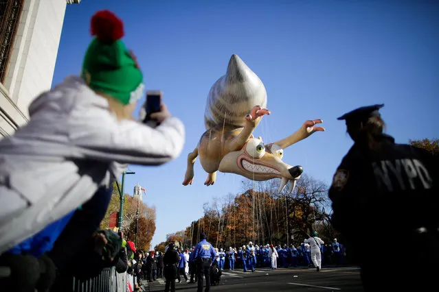 Ice Age's Scrat and his acorn is carried down Central Park West during the 91st Macy's Thanksgiving Day Parade in the Manhattan borough of New York City, New York, U.S., November 23, 2017. (Photo by Eduardo Munoz/Reuters)