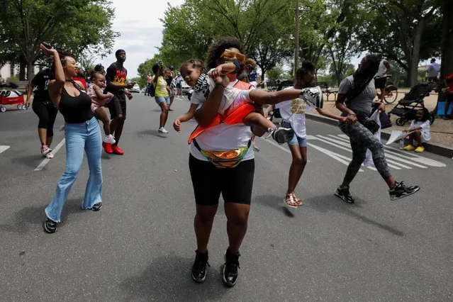 Women dance during the Black Mamas March as racial inequality protests continue in Washington, June 27, 2020. (Photo by Yuri Gripas/Reuters)