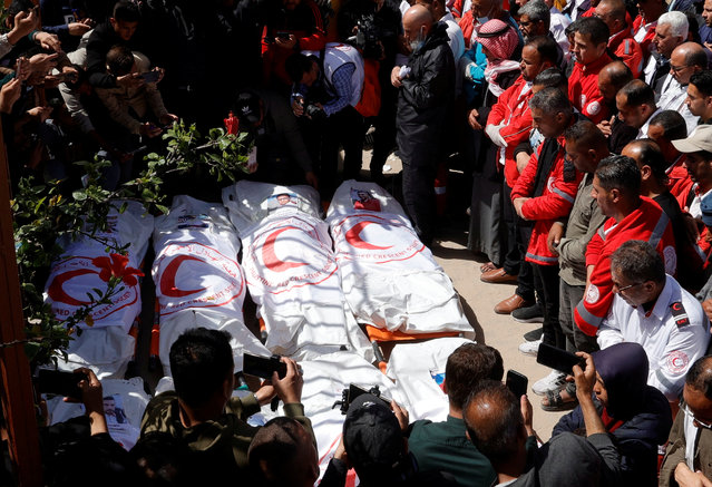 Palestinians mourn medics, who came under Israeli fire while on a rescue mission, after their bodies were recovered, according to the Red Crescent, at Nasser hospital in Khan Younis in the southern Gaza Strip on March 31, 2025. (Photo by Hatem Khaled/Reuters)