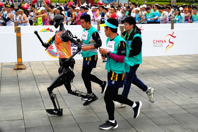 A robot takes part in what is billed as the world's first robot half marathon during the Humanoid Robot Half-Marathon held in Beijing on Saturday, April 19, 2025. (Photo by Ng Han Guan/AP Photo)