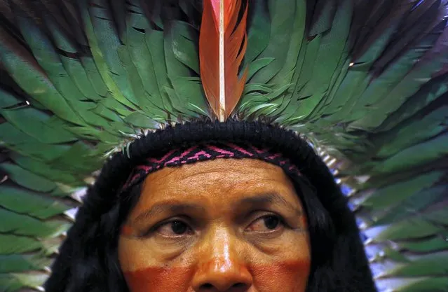 Brazil's indigenous woman looks on during a protest against the auction of oil and natural gas exploration rights, in Rio de Janeiro, Brazil, October 7, 2015. As Brazil prepares for its first sale of oil exploration rights in nearly two years on Wednesday, the auction is shaping up to be a mini-referendum on the willingness of investors to bet on the future of an industry under pressure and a Brazilian economy in turmoil. (Photo by Pilar Olivares/Reuters)