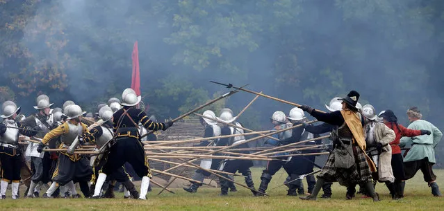 Participants wearing medieval costumes re-enact the 1620 battle of Bila Hora between Bohemian Estates and Austrian Imperial with Catholic forces in Prague, Czech Republic September 18, 2016. (Photo by David W. Cerny/Reuters)