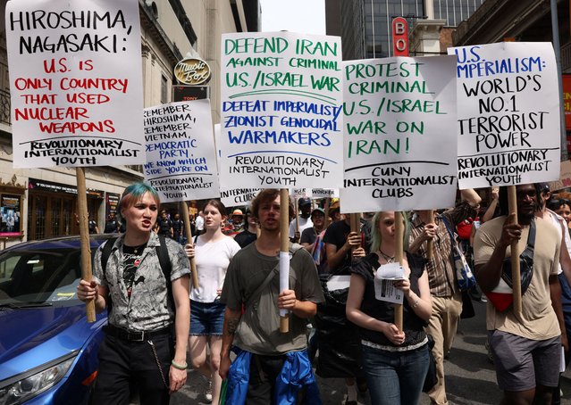 Demonstrators march following U.S attack on Iran's nuclear sites and against Iran-Israel conflict, at Times Square in New York City, on June 22, 2025. (Photo by Caitlin Ochs/Reuters)