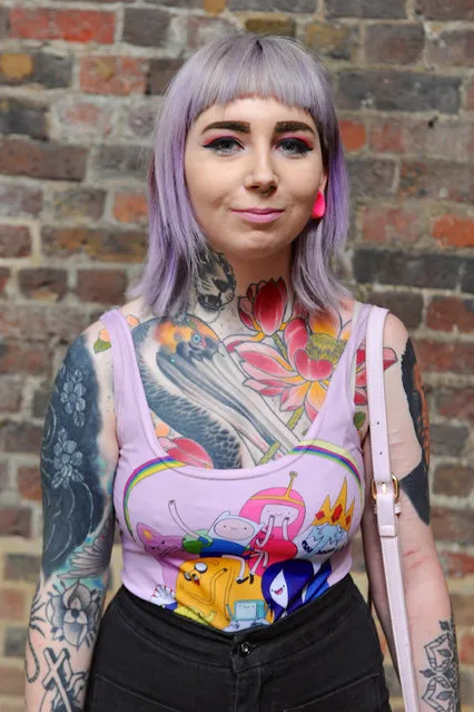 A tattooed woman at the opening day of the 12th London International Tattoo Convention, which opened today in Tobacco Dock, east London on September 23, 2016. (Photo by Michael Preston/Alamy Live News)