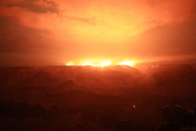 The Dragon Bravo Fire burns on the northern rim as seen from Grandeur Point on the southern rim of Grand Canyon, Arizona, on July 14, 2025. The lightning-sparked fire, which began on July 4, has destroyed up to 80 other structures including cabins, park administrative buildings and visitor facilities, according to the National Park Service, which runs the Grand Canyon National Park. (Photo by David Swanson/Reuters)