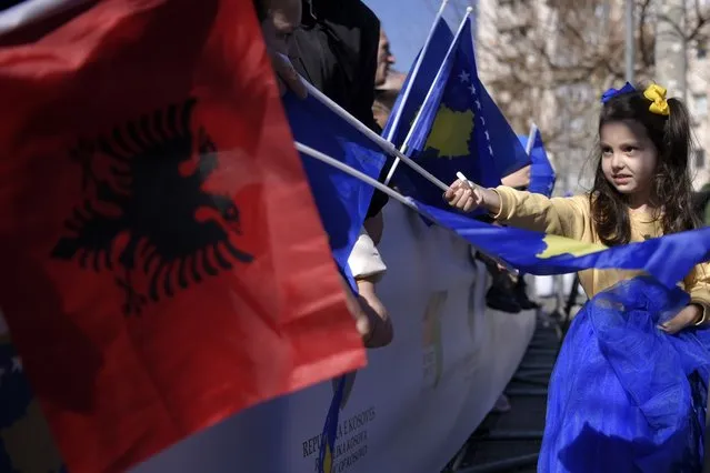 People wave Albanian and national flags during celebrations to mark the 15th anniversary of independence, in Pristina, Kosovo, Friday, February 17, 2023. Europe's youngest country, Kosovo, on Friday launched festivities for the 15th anniversary of its independence from neighboring Serbia with a military parade, wreath-laying ceremonies and a special Parliament session. But the celebrations are overcast by revived tension with Serbia, despite yearslong Western efforts to reconcile the former foes. (Photo by AP Photo/Stringer)