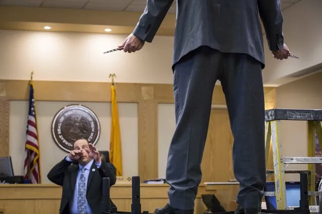 Sam Bregman, representing Keith Sandy, and Keith Sandy demonstrate the distance at which Sandy stood at the moment James Boyd was shot during his murder trial in Bernalillo County court, Monday, October 5, 2016 in Albuquerque, N.M. Sandy and former Albuquerque police officer Dominique Perez are charged with the 2014 shooting death of James Boyd in March 2014. (Photo by Juan Labreche/AP Photo)