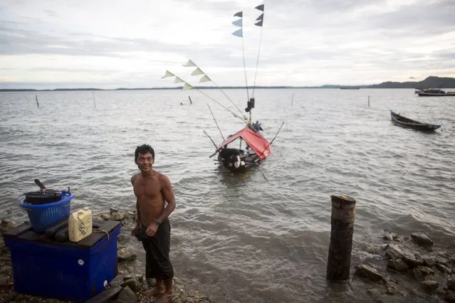 A fisherman prepares to fish with his small boat in Kyaukpyu township, Rakhine state, Myanmar October 6, 2015. (Photo by Soe Zeya Tun/Reuters)