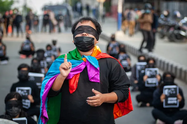 A youth activist wearing a face mask  gestures during a protest against the increasing cases of Rape in the country at a flash mob in Kathmandu, NepalKathmandu, Nepal on November 7, 2020. The incidence of rape has been increasing over the years with the previous fiscal year 2019/20 recording 2,144 cases of rape and 687 cases of rape attempt where most victims were minor girls. (Photo by Sujan Shrestha/SOPA Images/LightRocket via Getty Images)