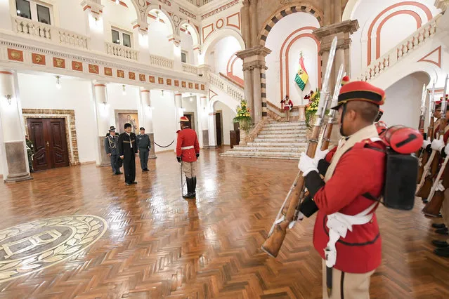 Bolivia's President Evo Morales listens to a report from the presidential guard at the Presidential palace in La Paz, Bolivia, October 19, 2016. (Photo by Freddy Zarco/Reuters/Courtesy of Bolivian Presidency)