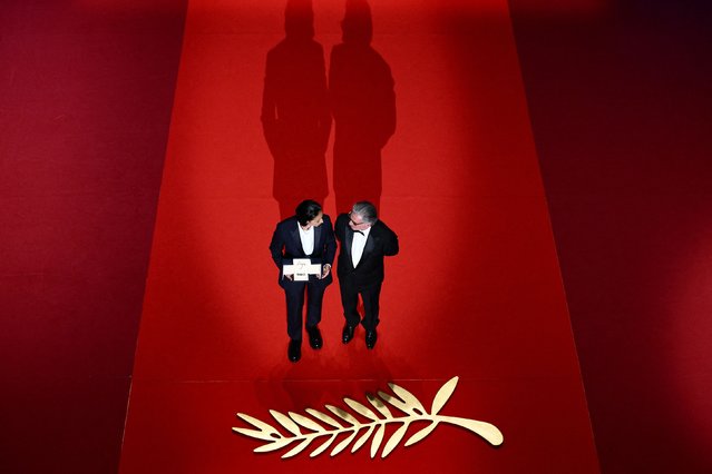 French actress Nadia Melliti receives the Best Actress Prize for her part in the film “La Petite derniere” (“The Little Sister”, alternatively called “The Last One”) from French actor Daniel Auteuil during the closing ceremony at the 78th edition of the Cannes Film Festival in Cannes, southern France, on May 24, 2025. (Photo by Antonin Thuillier/AFP Photo)