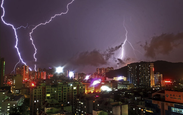 Lightning flashes in the sky in Zhuhai, Guangdong province, on May 23, 2013. Heavy rainfall since Saturday has killed two people in south China’s Guangdong Province, bringing the death toll resulting from rainstorms to 36 this year. (Photo by Reuters/Stringer)