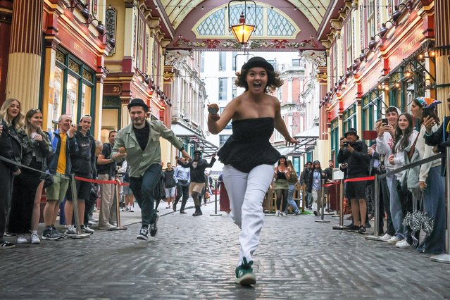 Competitors at the event. Leadenhall Market in the City of London hosts the Lamb Tavern's Scotch Egg Race in celebration of National Scotch Egg Day this afternoon on July 25, 2024. Competitors don bowler hats in a nod to the traditional City of London heritage of the area.The 12 teams include “Revolution Egghall” and “The Flying Scotch Egg” with the eventual winners being “Crouch's Scotch Crotch” and close 2nd ”The Golden Yolkers”. (Photo by Alamy Live News)