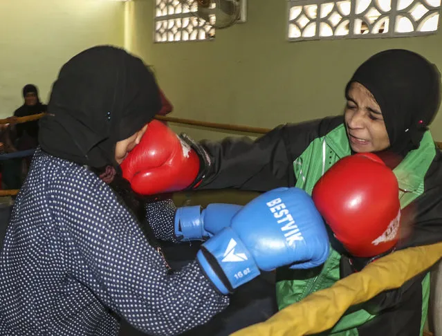 A 17-year-old Pakistani boxer Ansa Akbar (R) and Aqsa Akbar (L) practice during a practice session at the Pak Shaheen Boxing Club in Karachi, Pakistan on November 2, 2016. (Photo by Sabir Mazhar/Anadolu Agency/Getty Images)