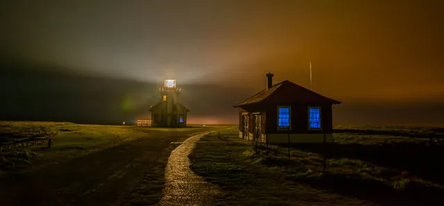 “Foggy Night at Point Cabrillo Light Station ”. Photo taken on a very foggy night at Point Cabrillo, near Mendocino, California. The old blacksmith building could only be seen when hit by the light of the lighthouse. (Photo and caption by Melissa Loeffler/National Geographic Traveler Photo Contest)