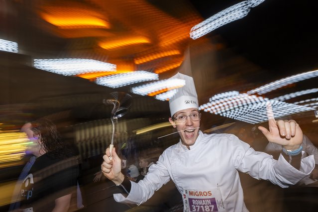 Dressed up participants run at the “Course de la Marmite” during the 46th Escalade Race (Course de l'Escalade) in Geneva, Switzerland, 07 December 2024. The sporting athletics event, with over 57,183 people registered for this year's edition, takes place in the Old Town of Geneva on 07 and 08 December 2024. (Photo by Martial Trezzini/EPA/EFE)