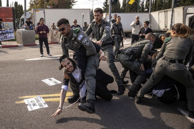 Ultra-Orthodox Jews protest against conscription in Israel, on January 28, 2025, in Tel Aviv, Israel. Wearing black suits, white shirts and fedora hats in accordance with their traditions, Ultra-Orthodox Jews, also known as Haredim blocked a street in the city. Some demonstrators, who also staged a sit-in protest, clashed with Israeli police officers who intervened. (Photo by Mostafa Alkharouf/Anadolu via Getty Images)