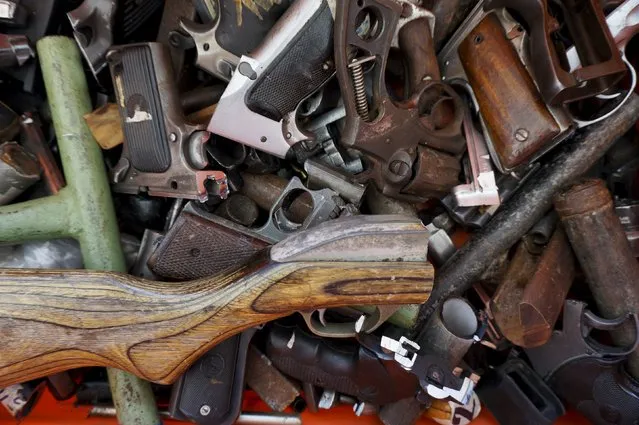 Seized weapons are seen after being destroyed by the authorities of the General Directive for the Control of Weapons and Munitions, (DIGECAM), in Guatemala City, December 17, 2015. (Photo by Jorge Dan Lopez/Reuters)