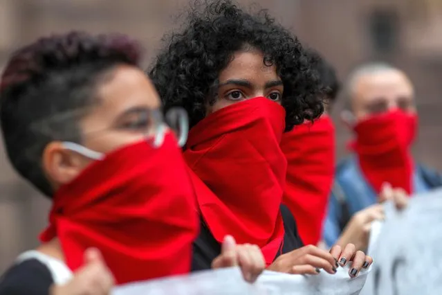 Women take part in a protest against parental alienation law on International Women's Day in Sao Paulo, Brazil on March 8, 2021. (Photo by Amanda Perobelli/Reuters)