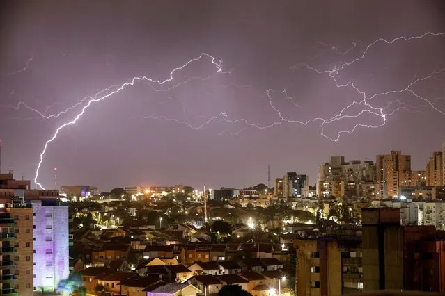 Lightning strikes over the coastal city of Ashkelon, Israel on February 6, 2023. (Photo by Amir Cohen/Reuters)