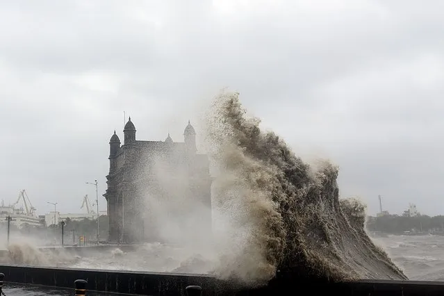 Waves lashes over following cyclone Tauktae at the Gateway of India in Mumbai on May 17, 2021. (Photo by Sujit Jaiswal/AFP Photo)