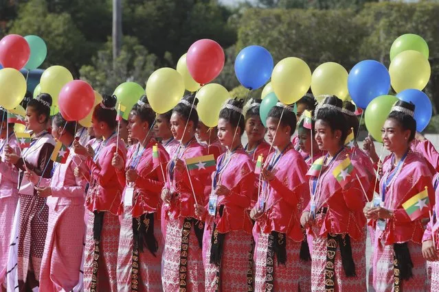 Ethnic Shan artists perform during a ceremony to mark the 8th anniversary of the Nationwide Ceasefire Agreement (NCA) at the Myanmar International Convention Center in Naypyitaw, Myanmar, Sunday, October 15, 2023. (Photo by Aung Shine Oo/AP Photo)
