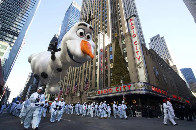 The Olaf balloon floats past Radio City Music Hall during the 92nd annual Macy's Thanksgiving Day Parade, Thursday, November 22, 2018, in New York. (Photo by Mary Altaffer/AP Photo)