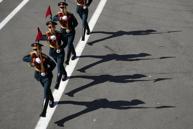 Honour guard soldiers march during the Victory Day military parade at Dvortsovaya (Palace) Square to celebrate 78 years after the victory in World War II in St. Petersburg, Russia, Tuesday, May 9, 2023. (Photo by Dmitri Lovetsky/AP Photo)