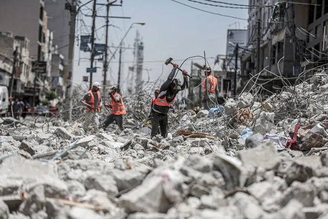Teams supported by Egyptian volunteers continue wreckage removal of As-Shuruk apartment destroyed by Israeli attack at al-Rimal neighbourhood in Gaza City, Gaza on June 07, 2021. (Photo by Ali Jadallah/Anadolu Agency via Getty Images)