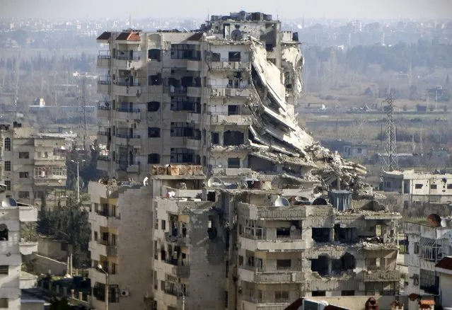 A general view shows damaged buildings in the northwestern Homs district of Al Waer January 18, 2015. (Photo by Reuters/Stringer)