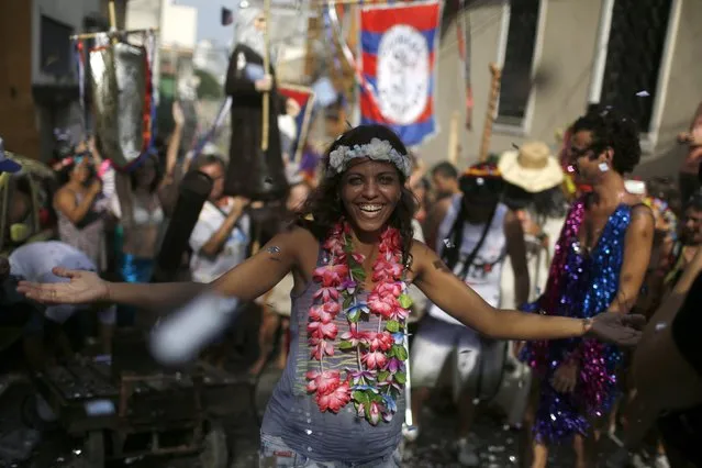 A reveller takes part in an annual block party known as “Cordao de Prata Preta”, one of the many carnival parties to take place in the neighbourhoods of Rio de Janeiro, February 6, 2016. (Photo by Pilar Olivares/Reuters)