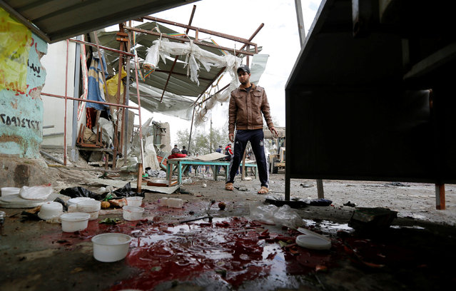 Blood stains are seen at the site of car bomb attack in a busy square at Baghdad's sprawling Sadr City district, in Iraq January 2, 2017. (Photo by Ahmed Saad/Reuters)