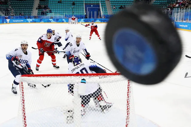 Players watch as the puck hits the glass in the first period of the Men's Play-offs Quarterfinals between the Czech Republic and the United States on day twelve of the PyeongChang 2018 Winter Olympic Games at Gangneung Hockey Centre on February 21, 2018 in Gangneung, South Korea. (Photo by Ronald Martinez/Getty Images)