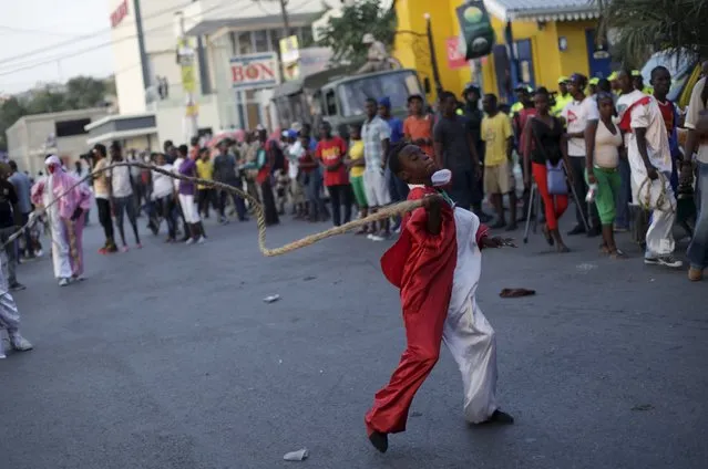 A reveller uses a whip as he takes part in the Carnival 2016 parade in Port-au-Prince, Haiti, February 9, 2016. (Photo by Andres Martinez Casares/Reuters)