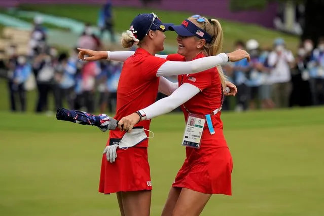 Nelly Korda, of the United States, left, celebrates with her sister Jessica Korda after winning the gold medal on the 18th hole during the final round of the women's golf event at the 2020 Summer Olympics.during the final round of the women's golf event at the 2020 Summer Olympics, Saturday, August 7, 2021, at the Kasumigaseki Country Club in Kawagoe, Japan. (Photo by Matt York/AP Photo)