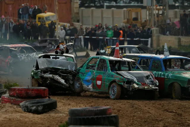 Drivers take part in a demolition derby organised by the Malta Motor Sports Association to raise funds for charity in Ta' Qali, outside Valletta, Malta, January 8, 2017. (Photo by Darrin Zammit Lupi/Reuters)